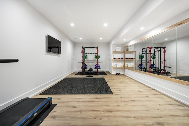 exercise area featuring hardwood / wood-style flooring