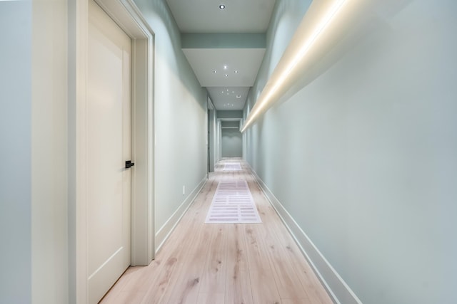 hall with light hardwood / wood-style floors