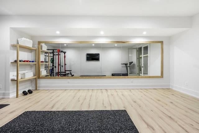 workout area featuring hardwood / wood-style flooring