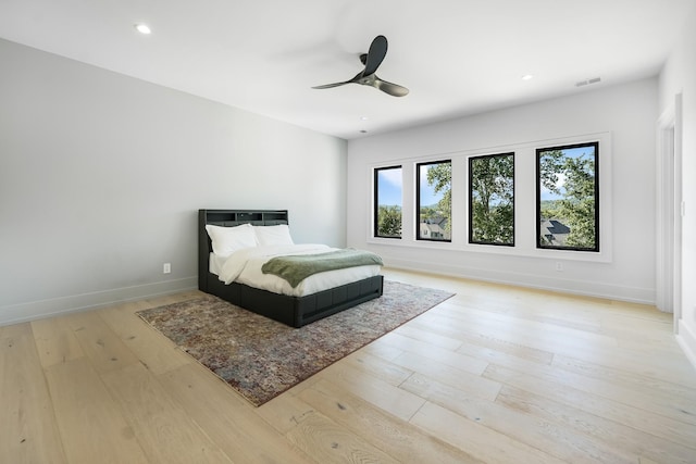 bedroom featuring ceiling fan and light wood-type flooring