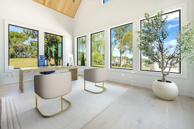 sunroom featuring wood ceiling and lofted ceiling