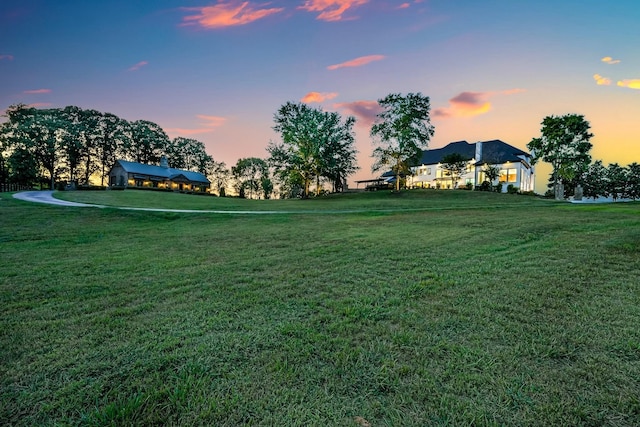 view of yard at dusk