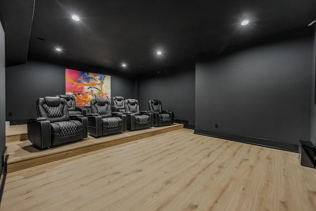 cinema featuring light hardwood / wood-style flooring