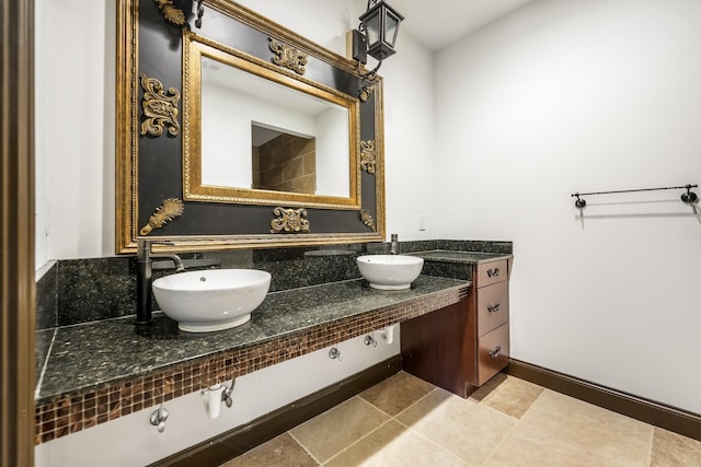 bathroom featuring tile patterned flooring and vanity