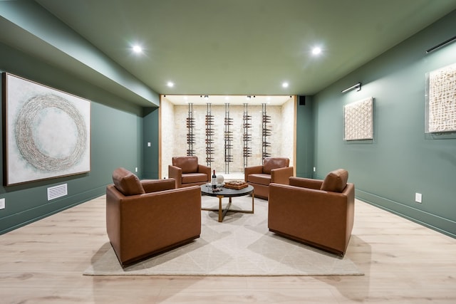 home theater room featuring light wood-type flooring