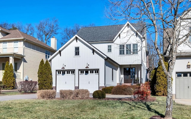 view of front of home with a garage and a front yard