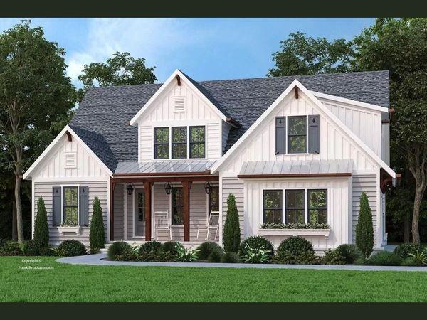 view of front of house featuring covered porch and a front lawn