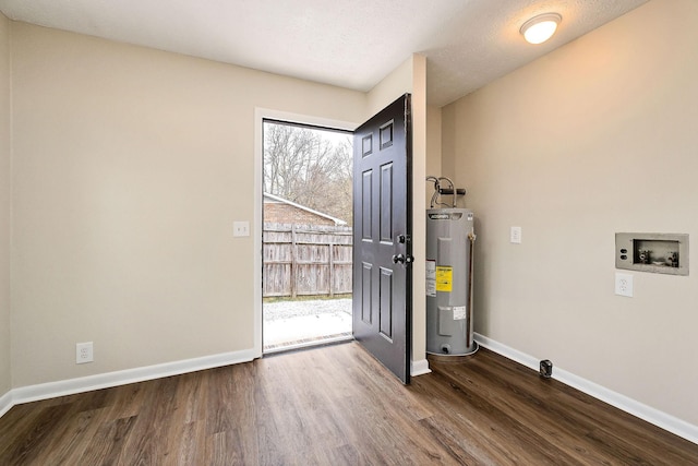 interior space featuring water heater and dark hardwood / wood-style flooring