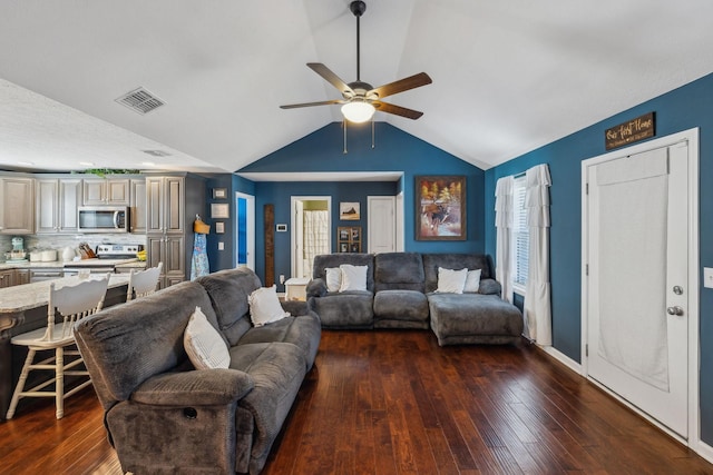 living room with dark wood-type flooring, ceiling fan, and vaulted ceiling