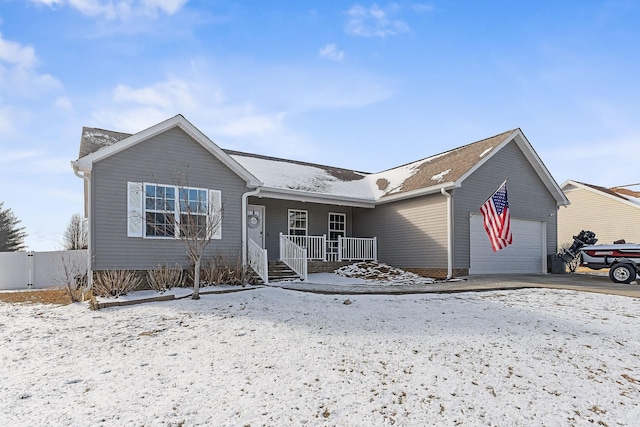 view of front of house with a porch and a garage