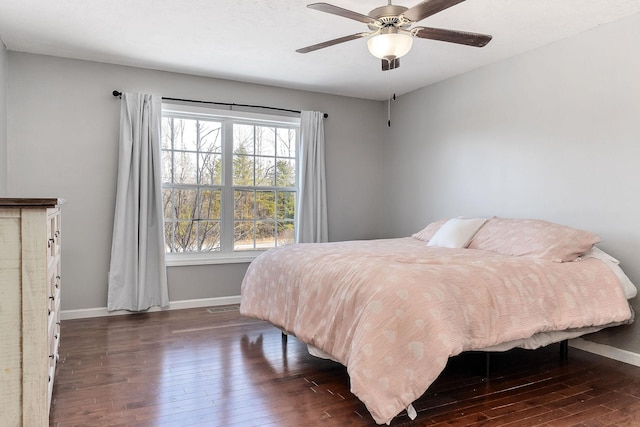 bedroom featuring dark wood-type flooring and ceiling fan