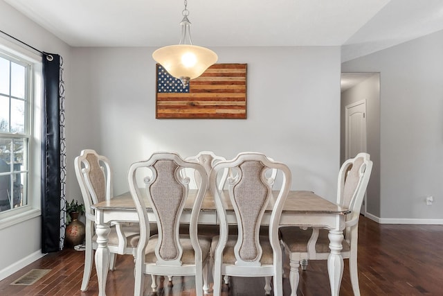 dining area with dark hardwood / wood-style flooring