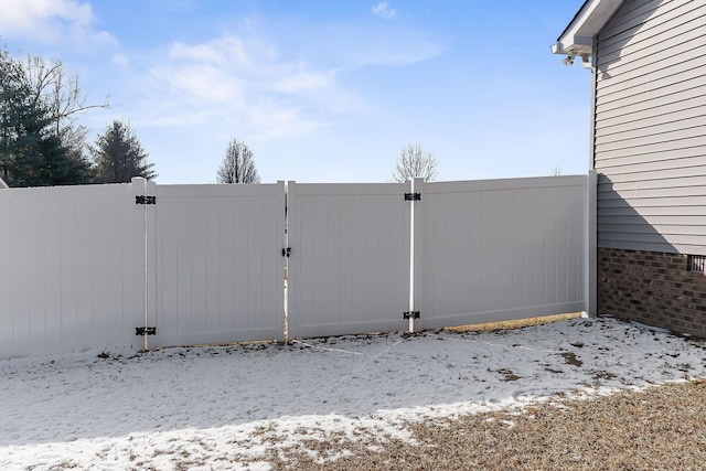 view of snow covered gate