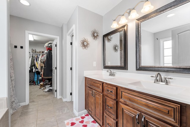 bathroom with tile patterned floors and vanity