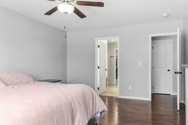 bedroom with ceiling fan and dark hardwood / wood-style flooring