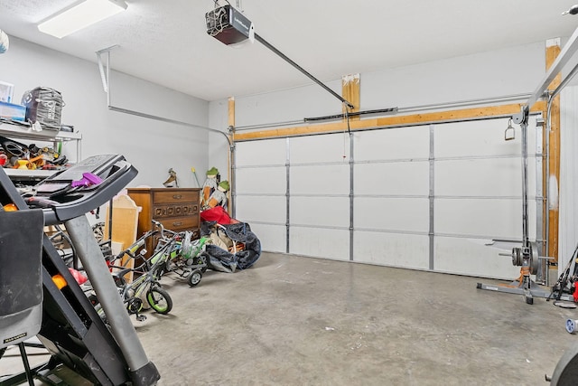 garage featuring a garage door opener