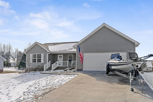 view of front of home featuring a garage and covered porch