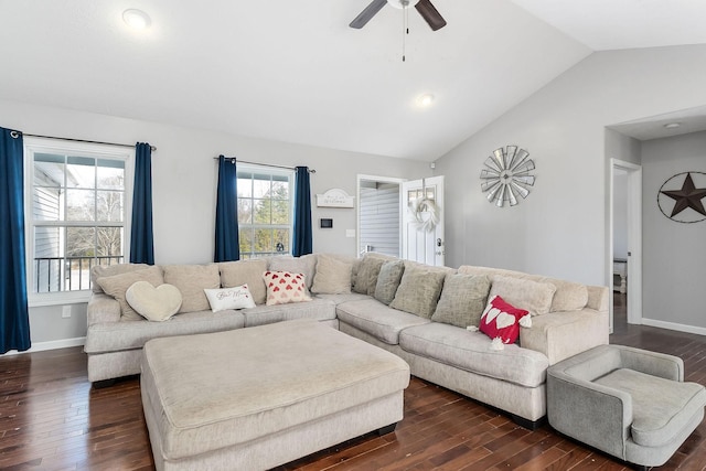 living room featuring ceiling fan, dark hardwood / wood-style flooring, and vaulted ceiling