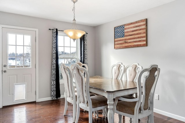 dining area with dark wood-type flooring