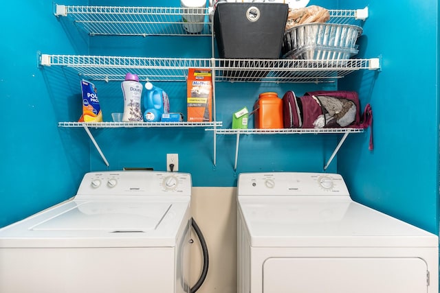 washroom featuring independent washer and dryer