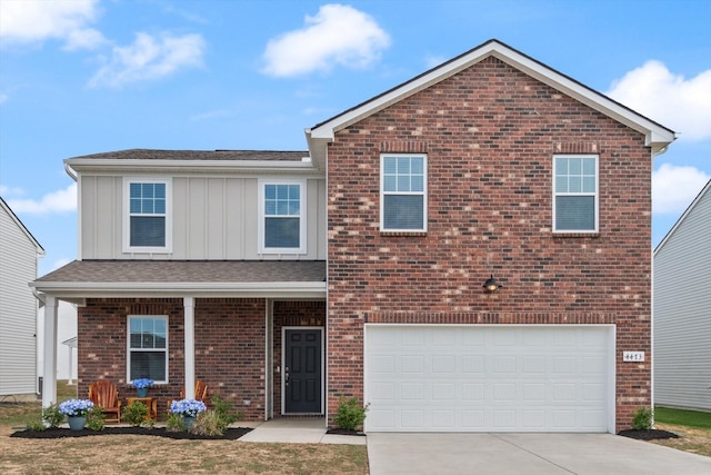 view of property featuring a garage and a porch