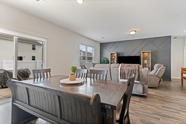 dining space featuring hardwood / wood-style floors