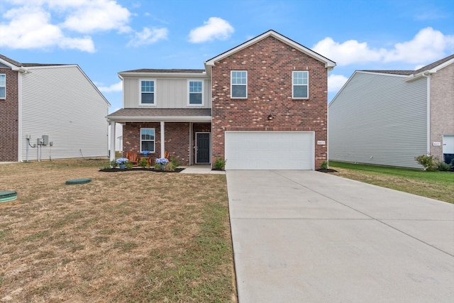 view of front facade featuring a garage, a front lawn, and covered porch