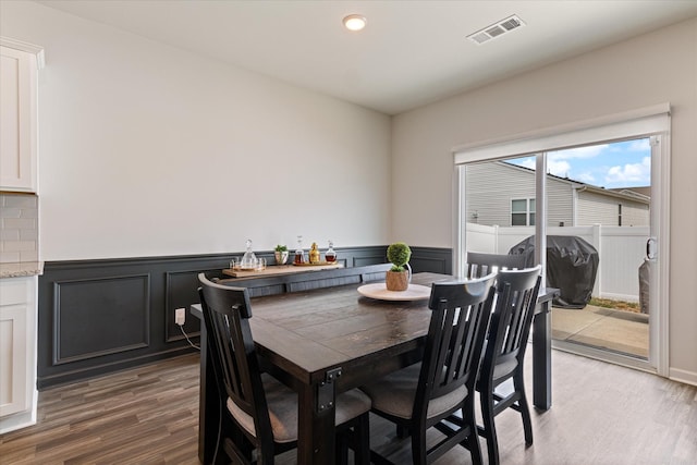 dining space featuring dark wood-type flooring