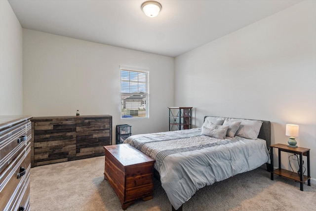 bedroom featuring light carpet