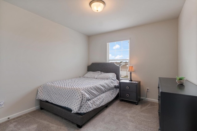 bedroom with light colored carpet