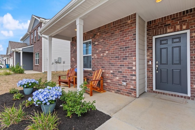 view of exterior entry featuring a porch