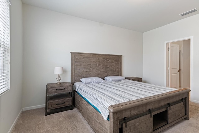 bedroom featuring light carpet