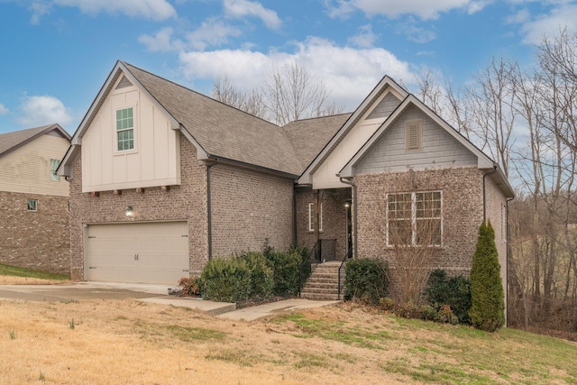 view of front of property with a garage and a front lawn