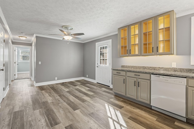 kitchen featuring ornamental molding, white dishwasher, light stone countertops, and light wood-type flooring