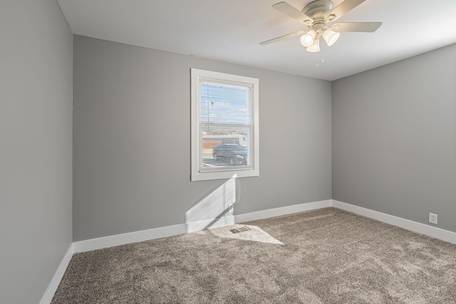 empty room with carpet floors and ceiling fan