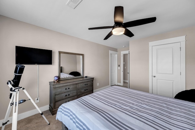 bedroom featuring light colored carpet and ceiling fan