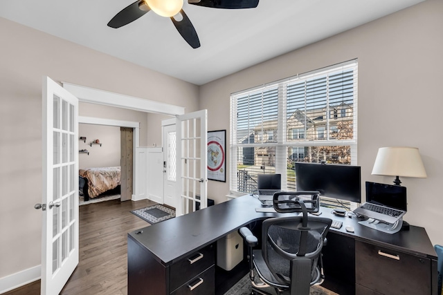 office space with dark wood-type flooring, ceiling fan, and french doors