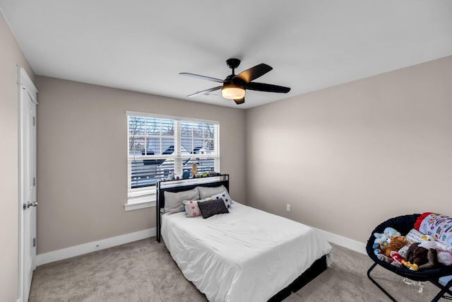 carpeted bedroom featuring ceiling fan