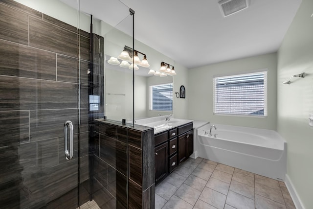 bathroom featuring tile patterned floors, vanity, and plus walk in shower