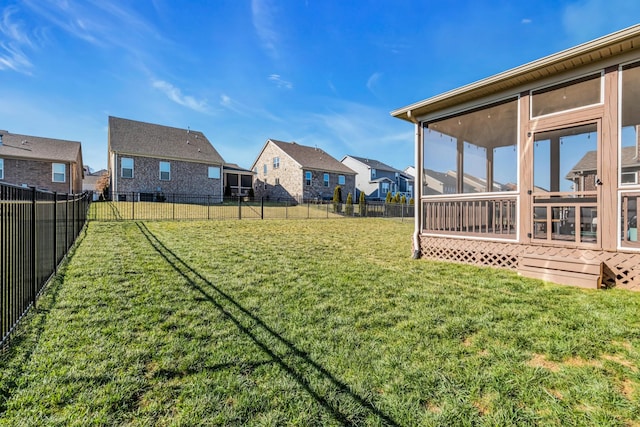 view of yard featuring a sunroom