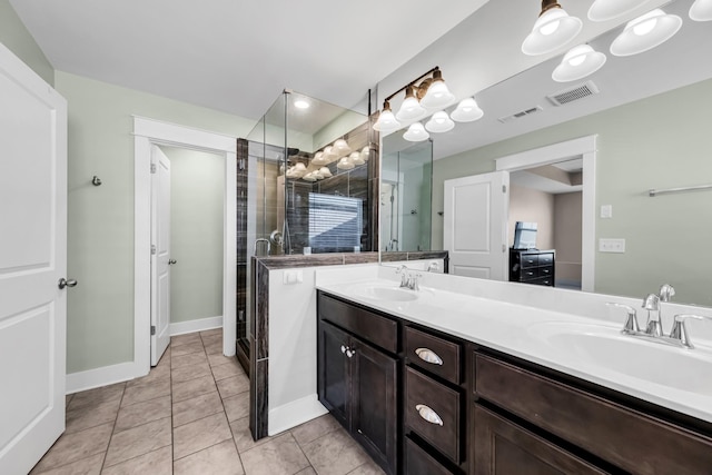 bathroom featuring tile patterned flooring, vanity, and an enclosed shower