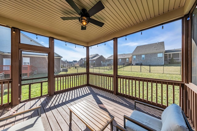 sunroom / solarium with ceiling fan