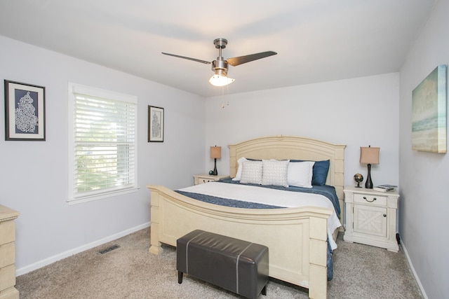 bedroom with light colored carpet and ceiling fan