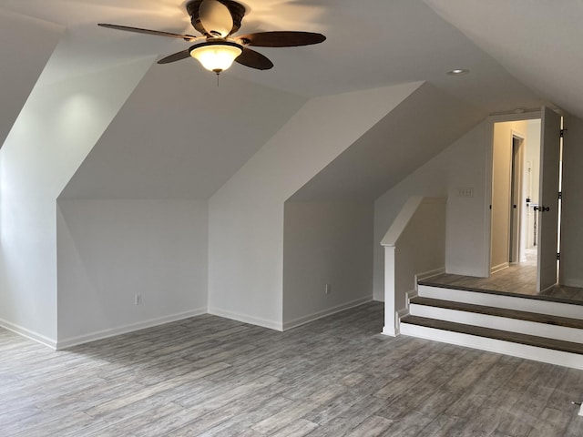 bonus room with baseboards, vaulted ceiling, recessed lighting, wood finished floors, and a ceiling fan