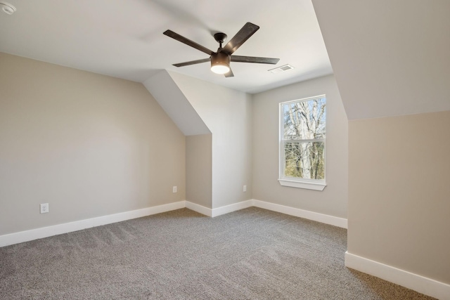 bonus room featuring ceiling fan, lofted ceiling, and carpet flooring