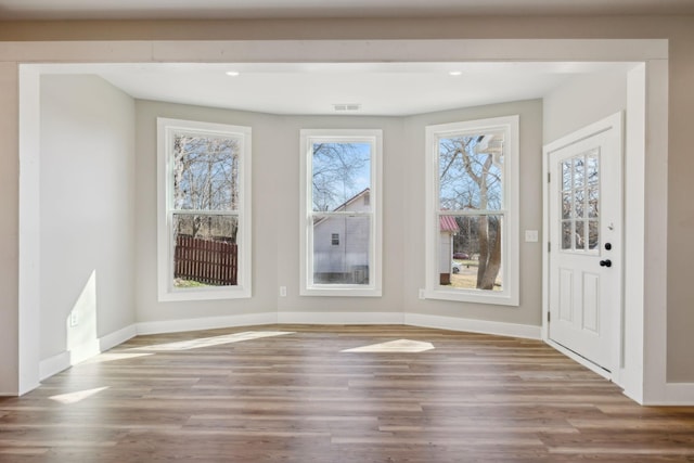 interior space with hardwood / wood-style flooring