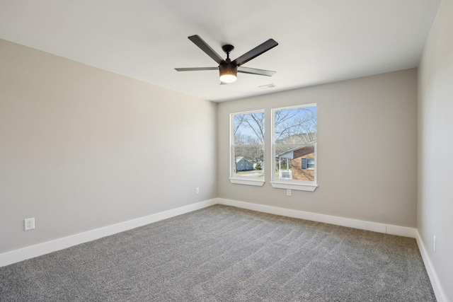 carpeted empty room featuring ceiling fan