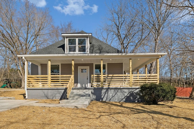 view of front of home featuring a porch and roof with shingles