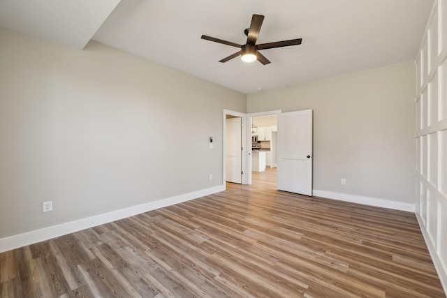 unfurnished bedroom with hardwood / wood-style flooring and ceiling fan