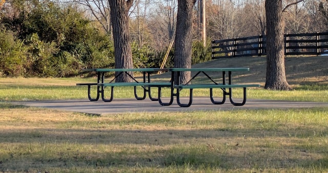 view of property's community with a lawn